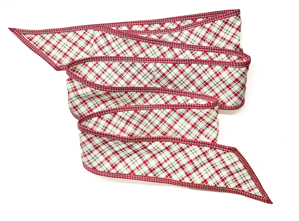 plaid fabric ribbon with red binding on a white background.