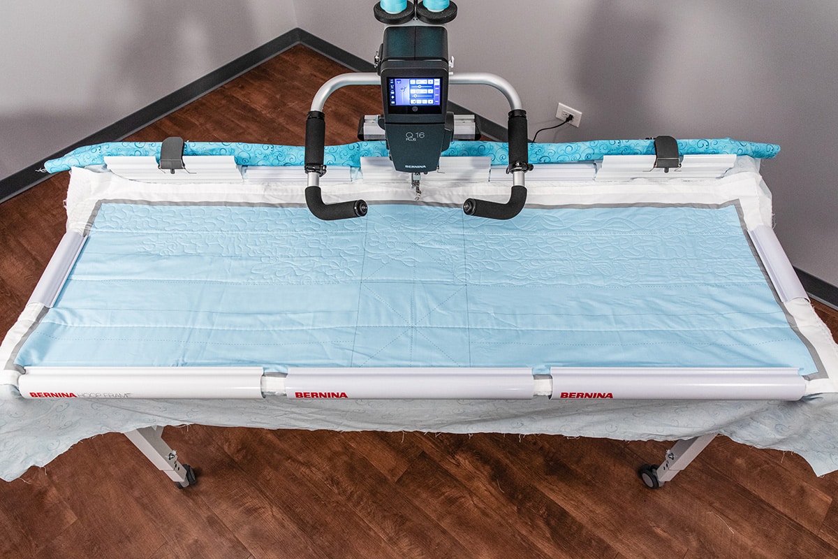 Fabric hooped on Hoop Frame with Q Series Sewhead