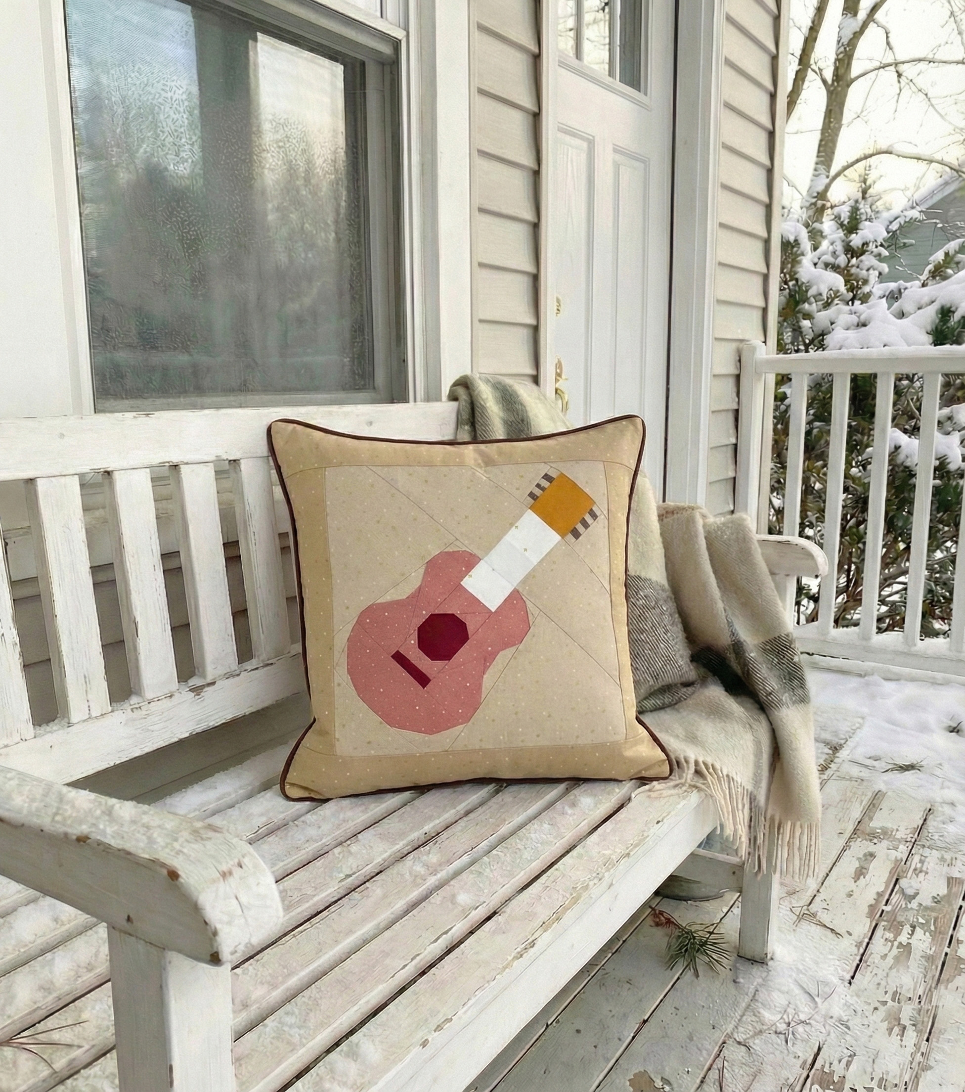 Guitar pillowcase on a bench