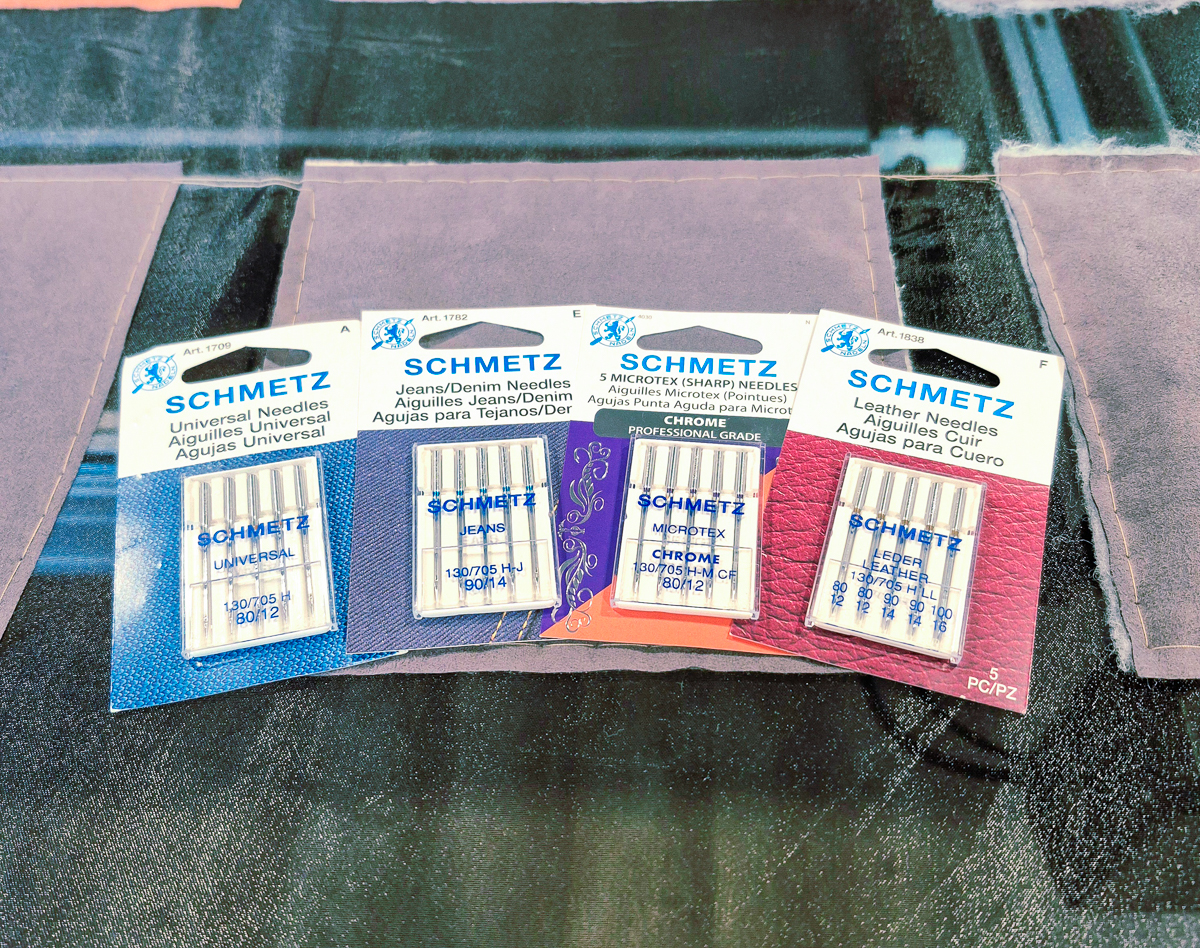 Four packages of machine needles