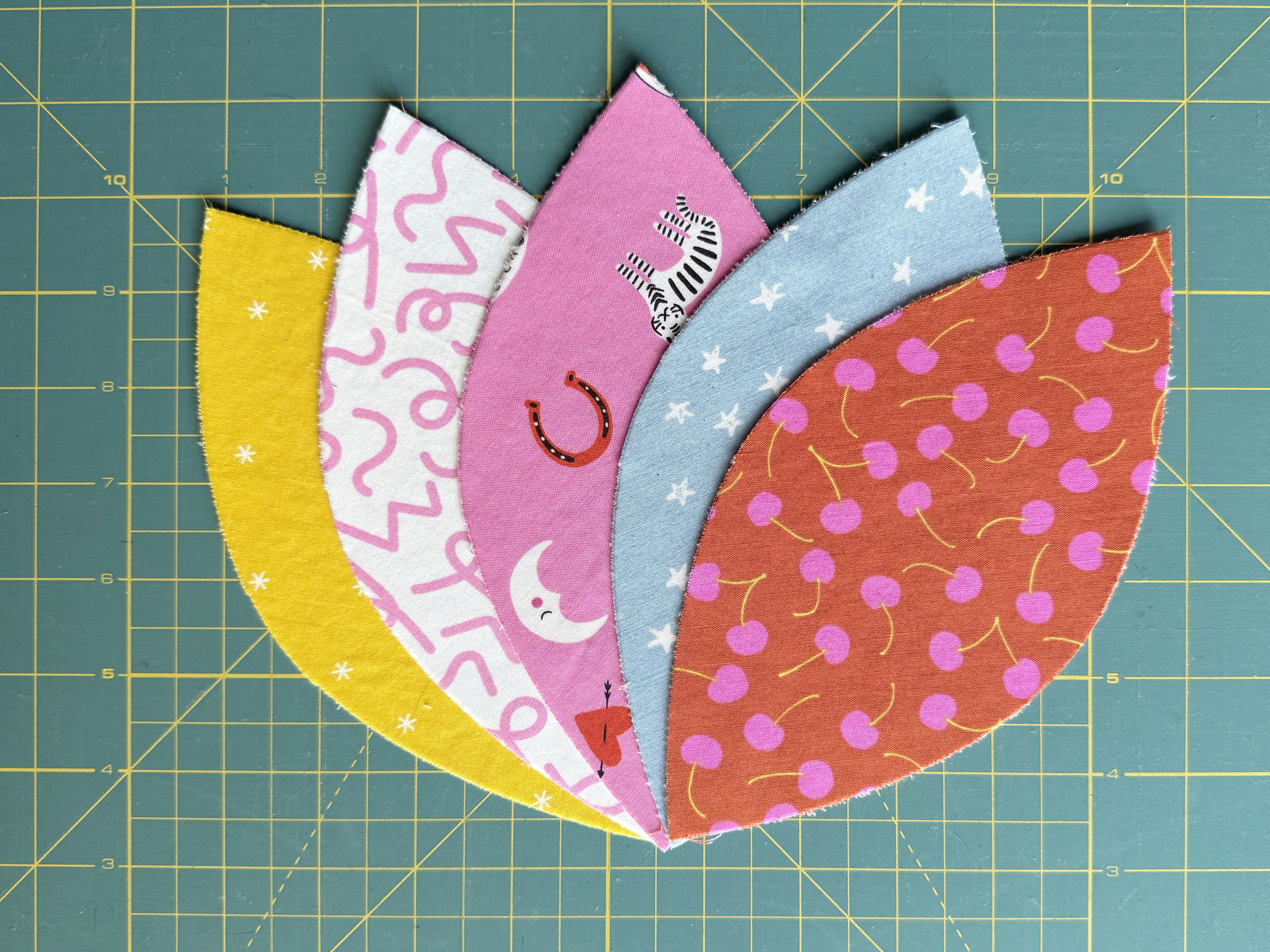 cut out appliques on green background