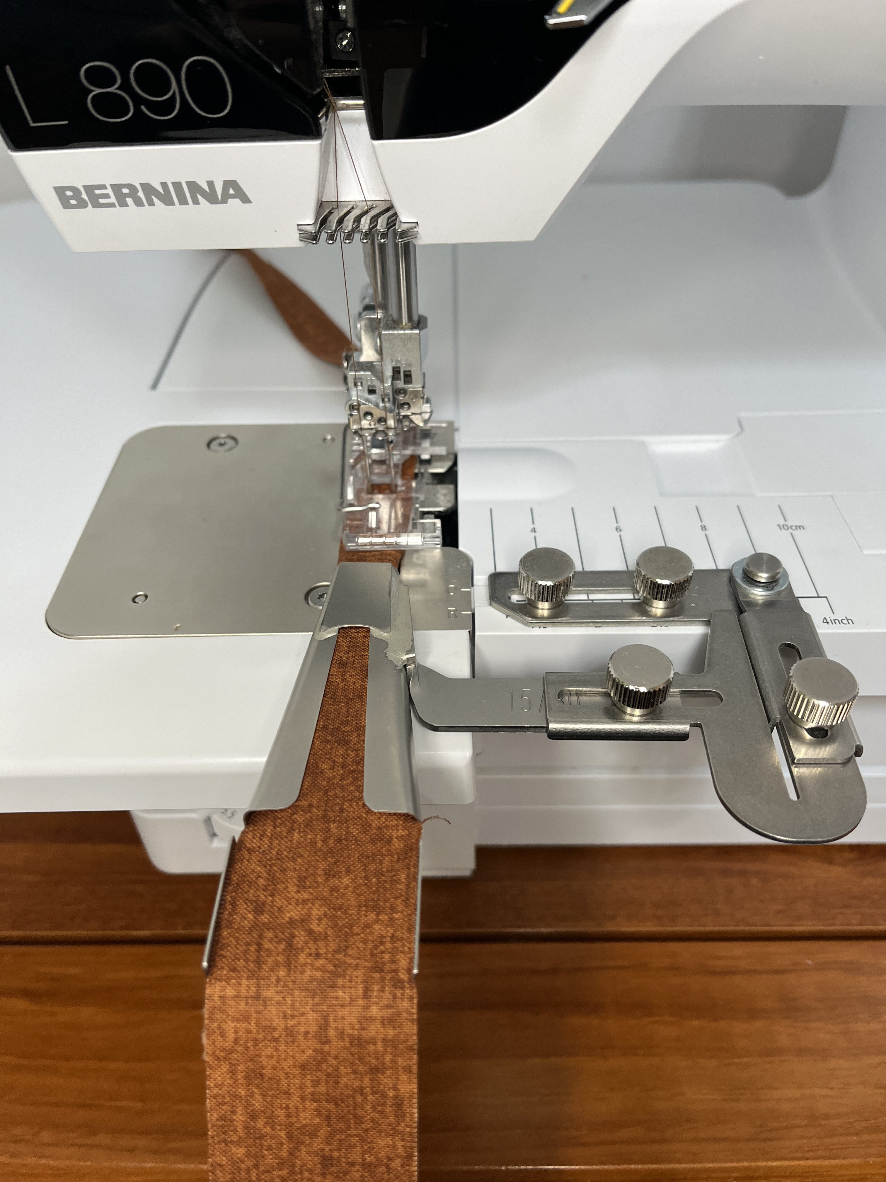 Stitching a brown strip of fabric