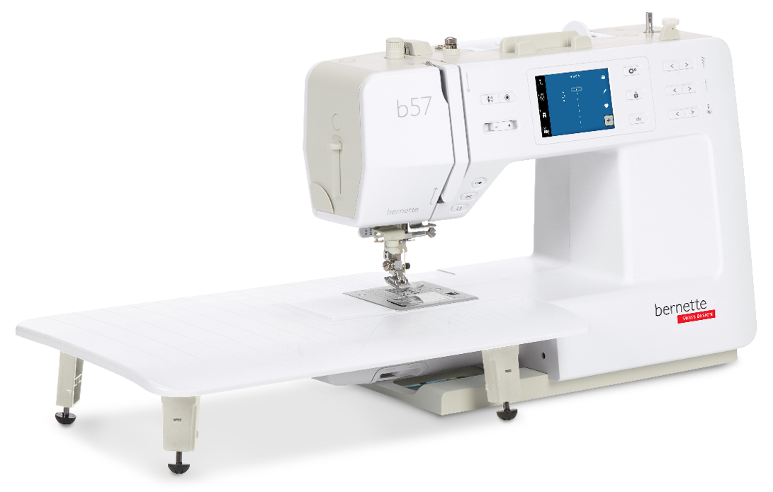 A compact sewing machine featuring a small touch screen and large extension table