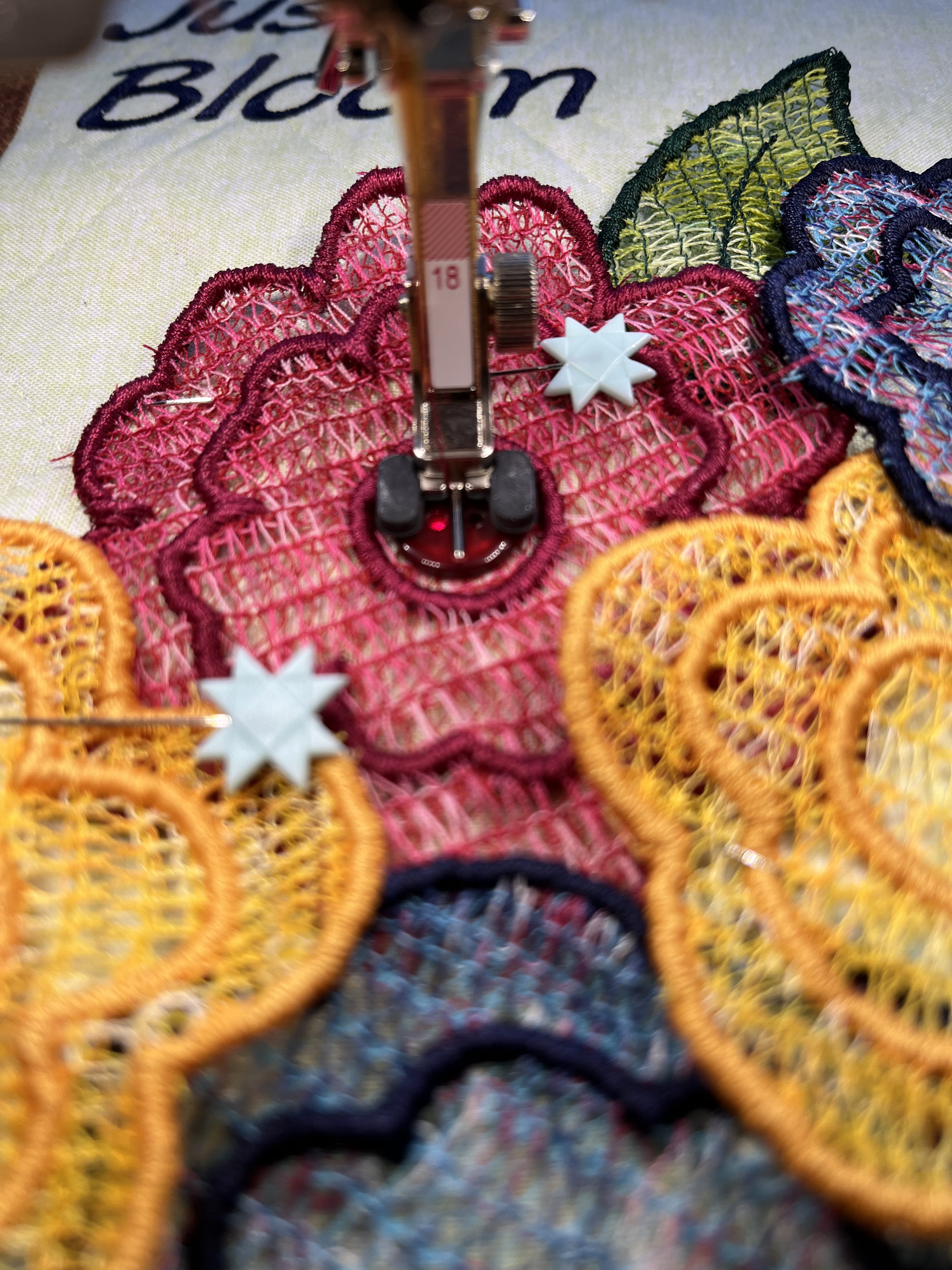 Sewing buttons to flowers