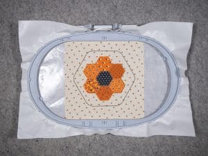 trim the center hexagon fabric shape right up to the cutting stitch.