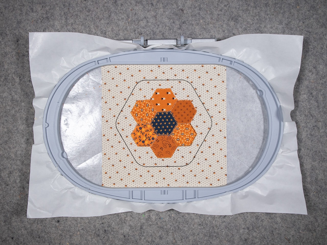 trim the center hexagon fabric shape right up to the cutting stitch.