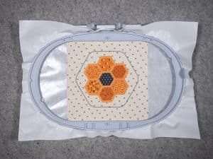 step-fill stitch around all the hexagon fabric shapes.