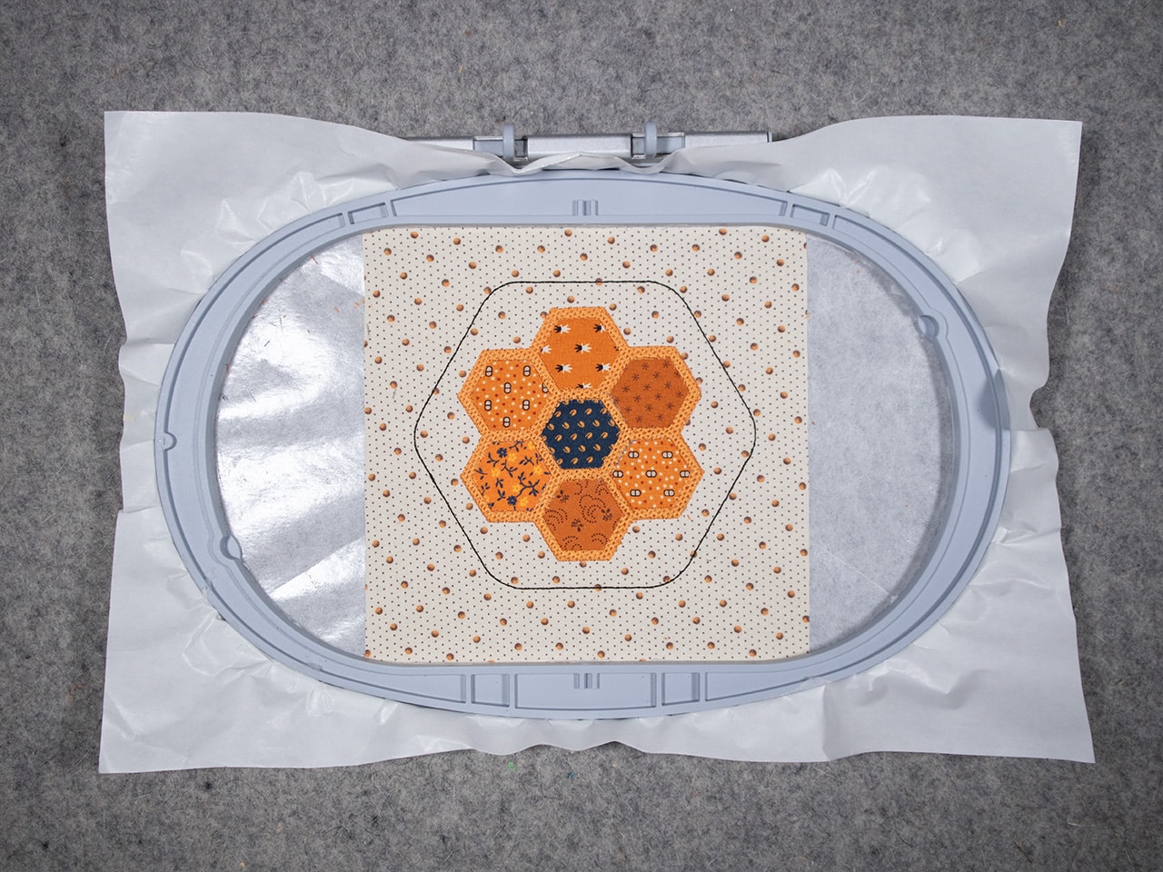 step-fill stitch around all the hexagon fabric shapes.