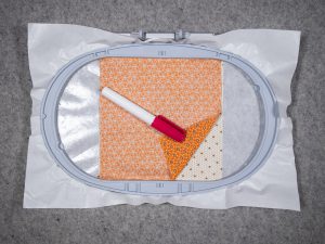 dhere the backing fabric with a dab in the four corners of the 6 ½” square.
