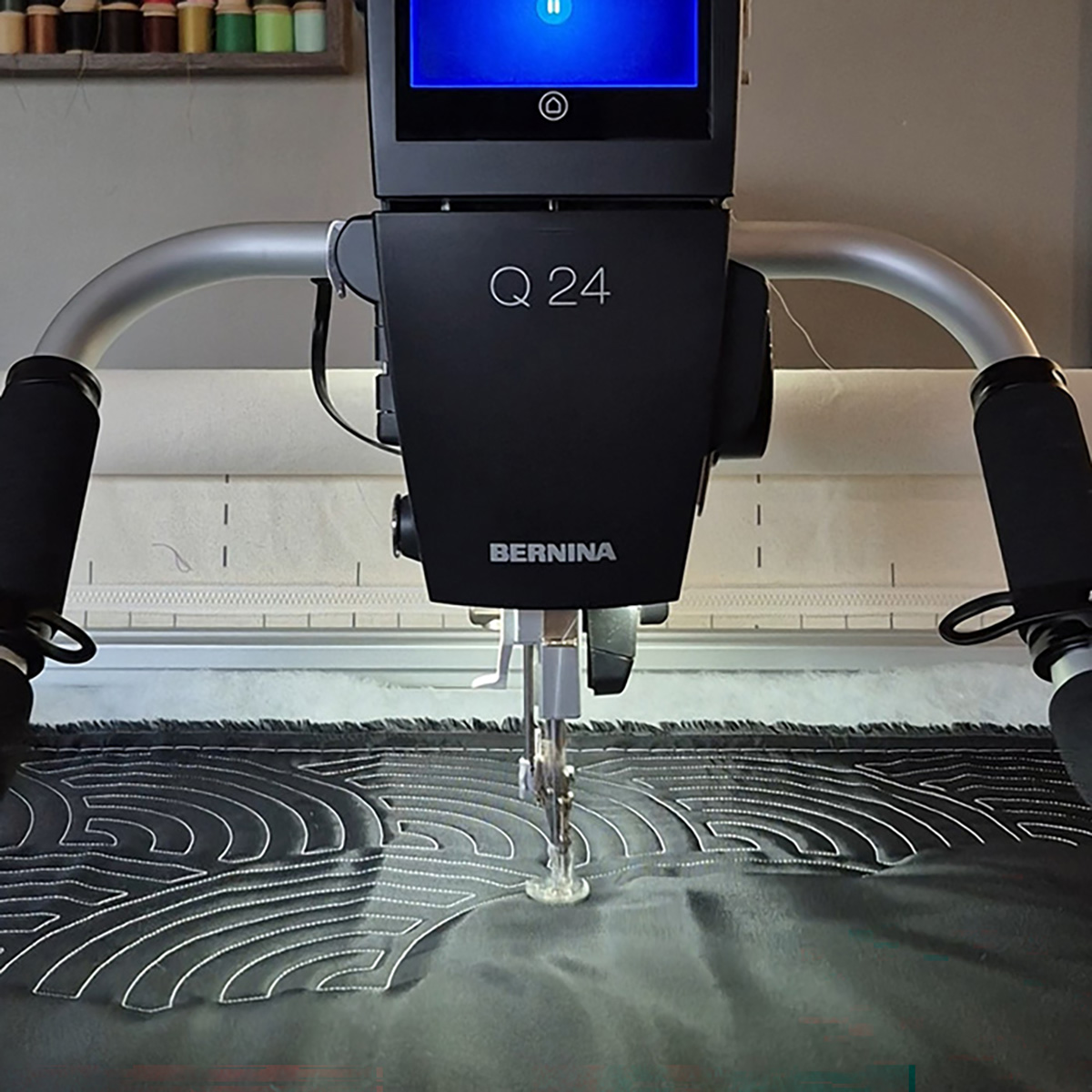 Head-on view of the BERNINA Q24 Sewhead stitching on Nylon