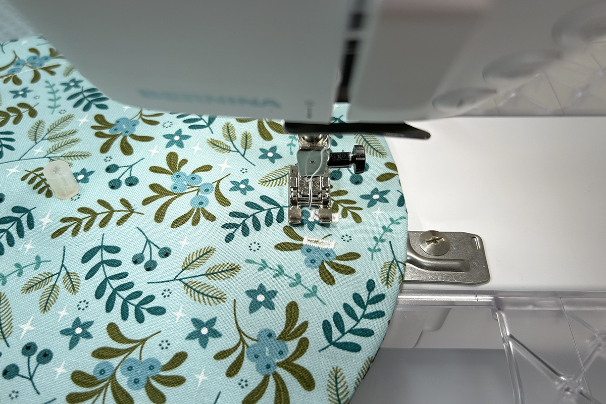 sewing near the bottom of the buttonholes