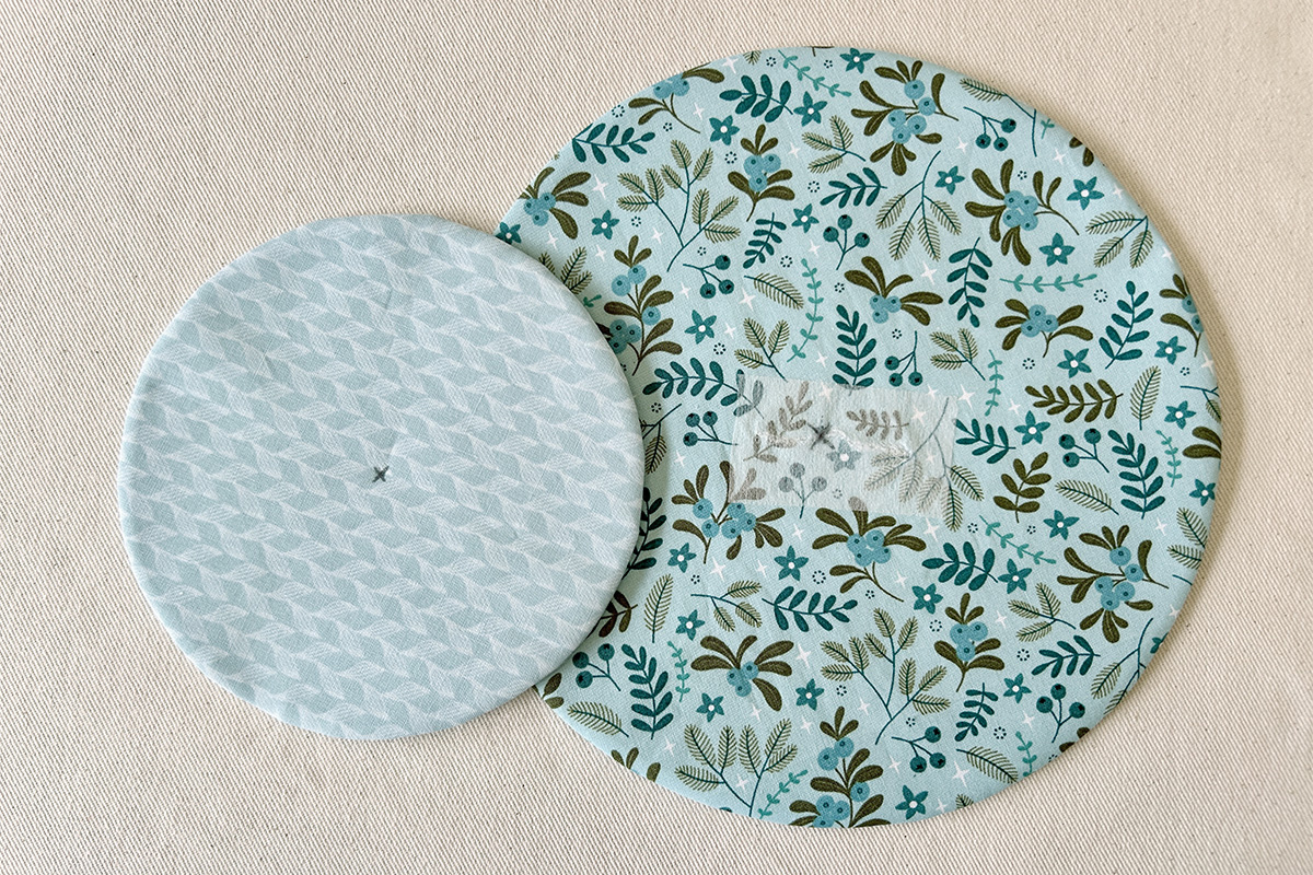 both fabric circles with center marks