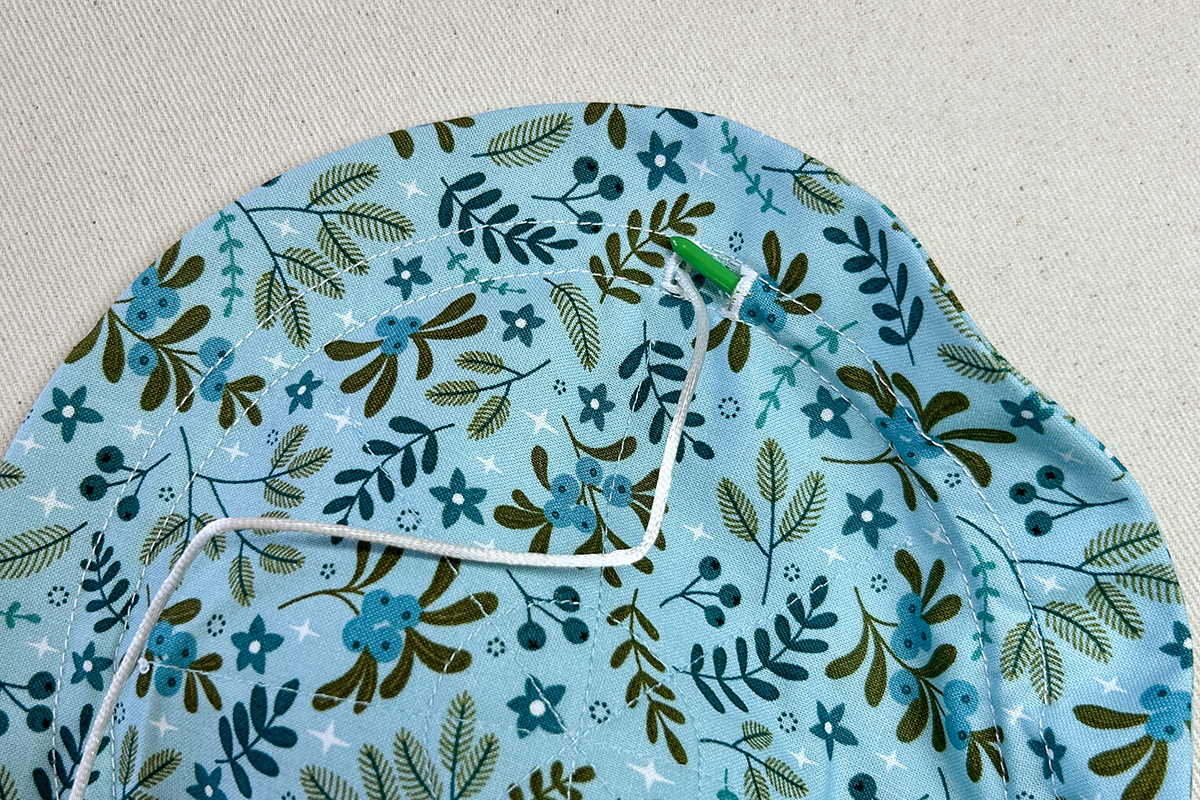 removing drawstring with bodkin from buttonhole